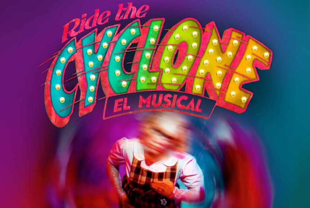 Colorful neon-style marquee reading ‘GIGGLES’ with a blurred performer on a purple stage background.